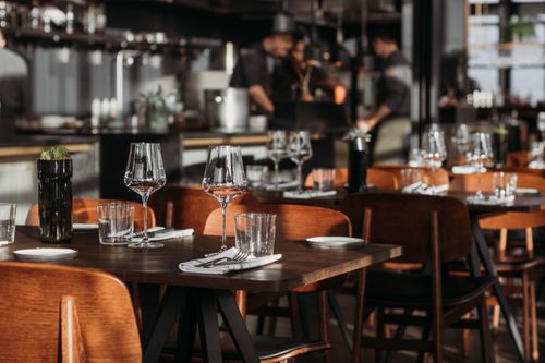 Elegant restaurant dining room with set tables and wine glasses
