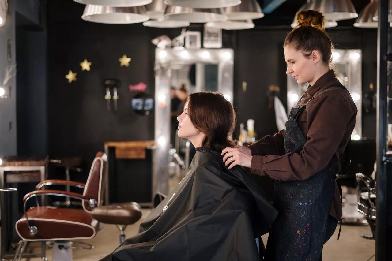Stylist working with a client inside a salon